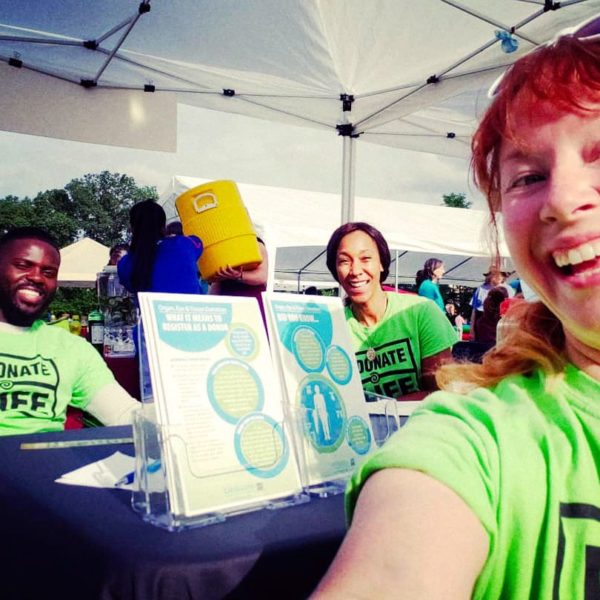 Selfie of LifeSource volunteers at an information table